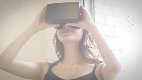 animation of mathematical drawings and equations over woman wearing vr headset