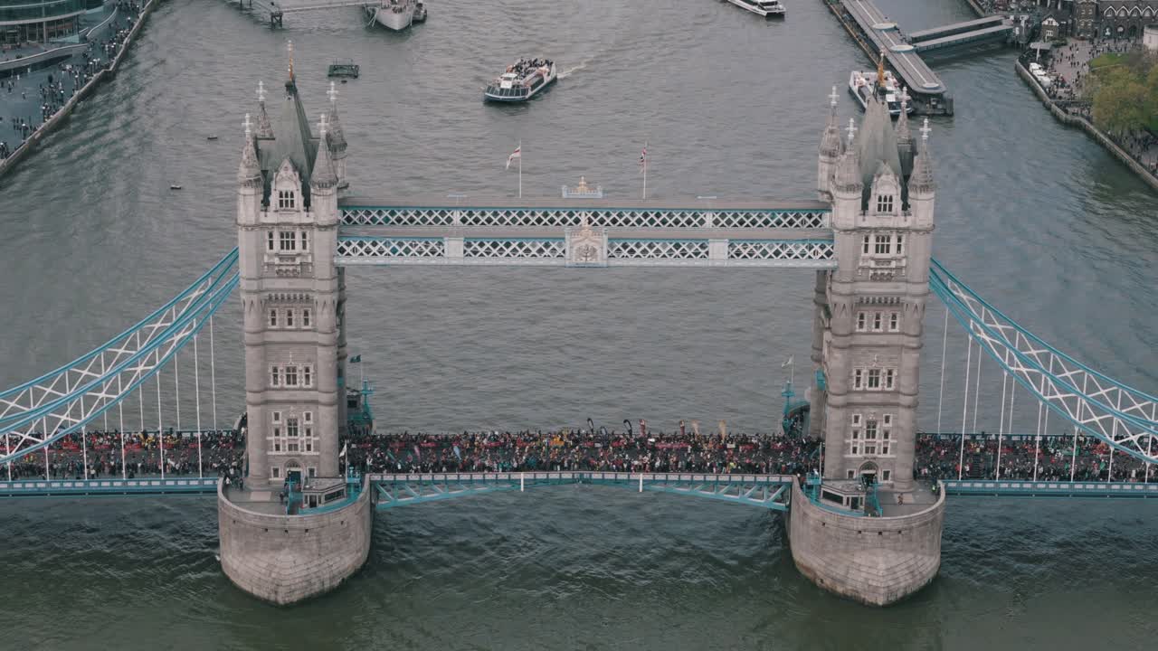 Tilted Down Shot of Marathon on Tower Bridge and Approaching Boat