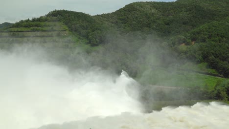 Powerful-scene-of-water-coming-out-Yongdam-in-Korea-during-rainy-season,-static