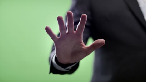 businessman uses fingerprint scanner. shot on green screen. cu