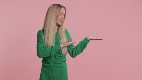 young woman showing thumbs up pointing at right on blank space place for your advertisement logo