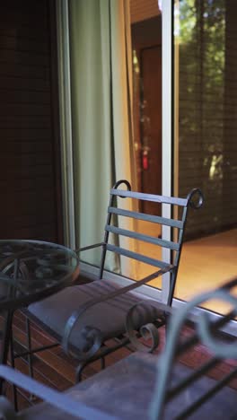 relaxing patio scene with metal chairs and table