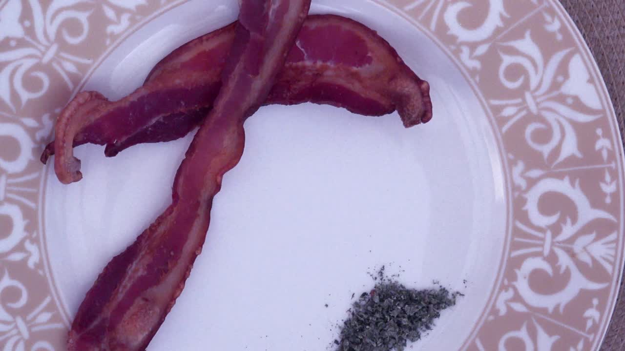 POV Birds Eye View of A Plate of Bacon strips and Marijuana, Cannabis Slow pan