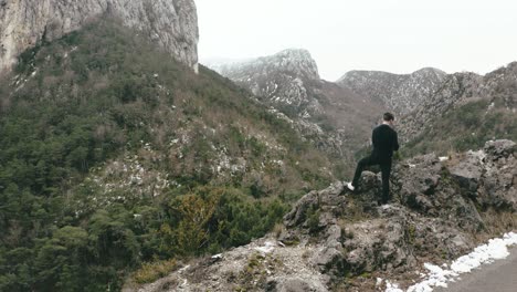 man filming limestone rocks and scenic valley of verdon gorge, france