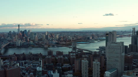 Aerial-descending-shot-of-cityscape-with-Manhattan-bridge.-Revealing-courts-buildings.-Manhattan,-New-York-City,-USA