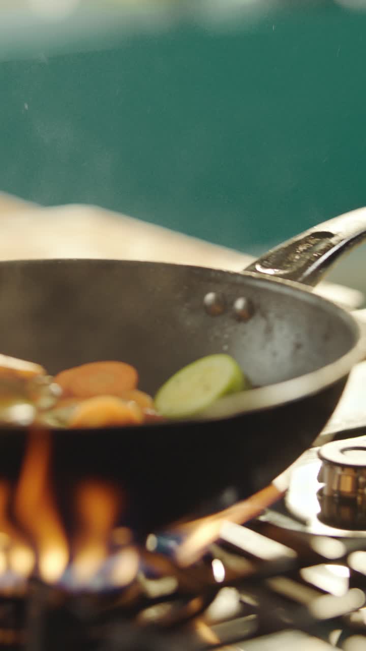 Vegetables stir fried on a gas stove