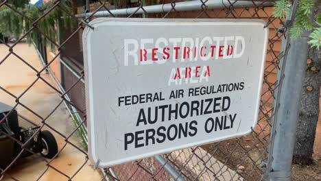 a restricted area sign at an airport authorized persons only faa regulations