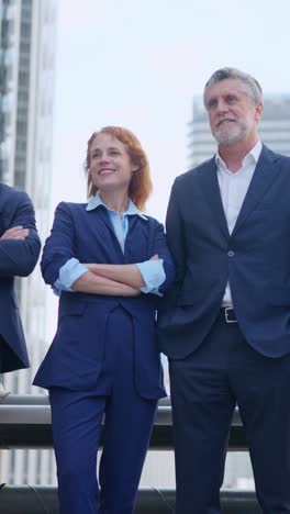 confident business professionals standing outdoors