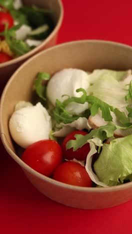 healthy salad in a paper bowl