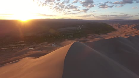 aerial drone shot zoom out over sand dunes in gobi desert mongolia