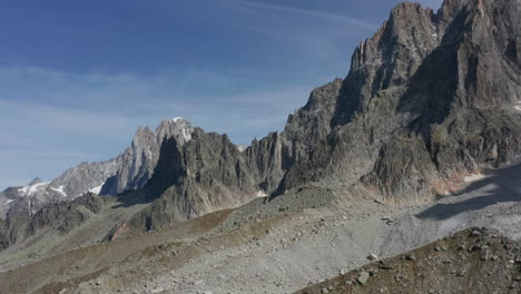 Low-aerial-over-rocky-mountain-slope