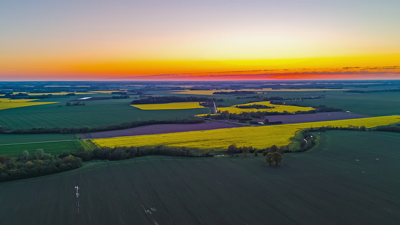 Colorful Plains Against Sunset Sky During Springtime. Aerial Drone Shot