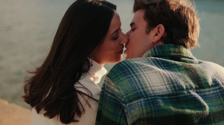 Couple&#039;s Kiss by the River in Seville