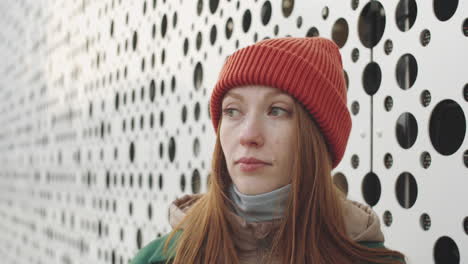 woman wearing a red beanie