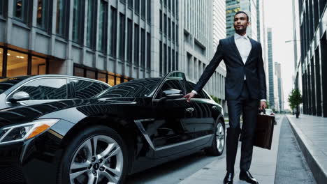 businessman with a luxury car in the city
