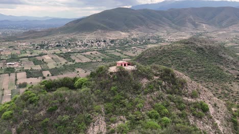 Aerial-shot-of-a-chapel-on-a-holy-peak-in-the-Central-Valleys-of-Oaxaca