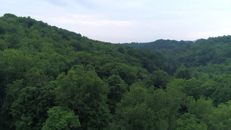 a slow rising aerial establishing shot of the allegheny mountains and valley