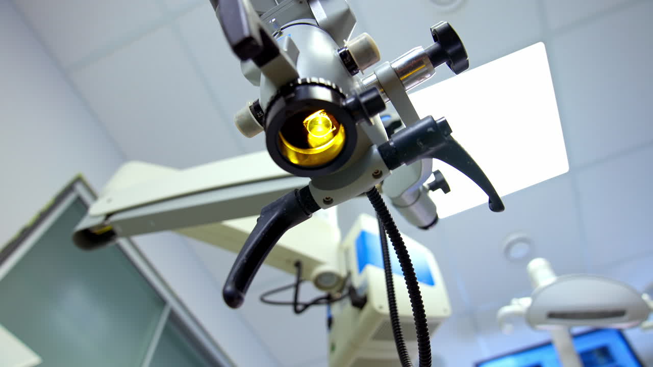 Scientific laboratory microscope. Contemporary microscope in the laboratory on the ceiling background. Close-up. Education, science or medicine industry.