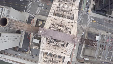 cinematic 4k aerial birds eye pan up of queensboro bridge nyc