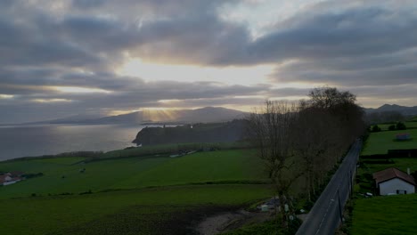 The-dawn-breaks-over-the-hills-and-ocean-shores-of-the-Portuguese-Riviera-in-Açores,-Portugal,-capturing-the-serene-beauty-and-tranquility-of-coastal-scenery