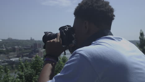 african american male taking photos of a scenic overlook stabilized shot in 4k uhd