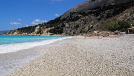 sea and stony beach - agia kiriaki beach in greece at daytime - wide shot