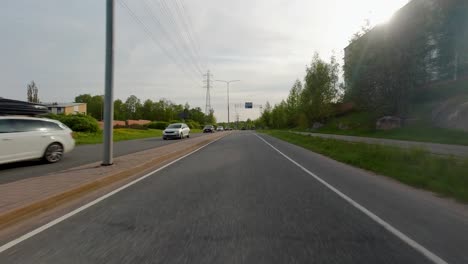 Driving-on-a-busy-public-road-outside-Helsinki-on-a-calm-afternoon