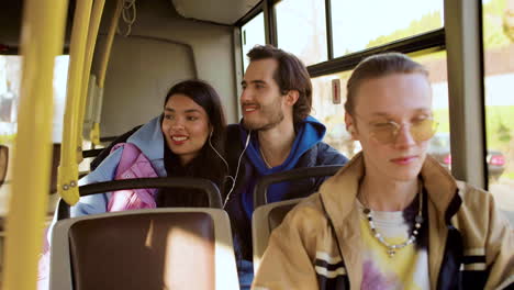 young man listening music in the bus