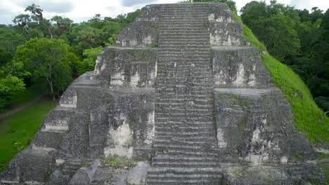 spectacular aerial shot over the tikal pyramids in guatemala 2