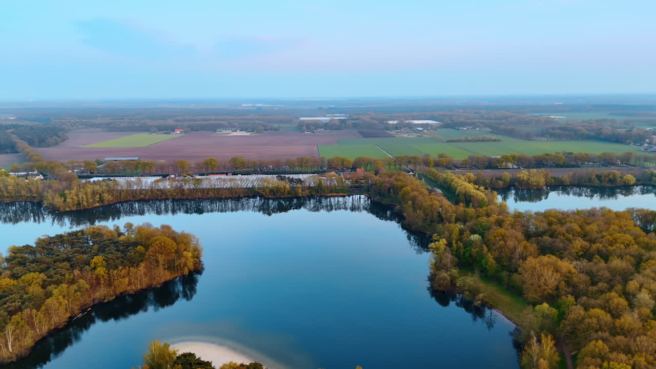 Autumn Dutch rivers and fields. Stunning aerial view of Dutch waterways and vibrant fall foliage captures autumn's beauty in the Netherlands