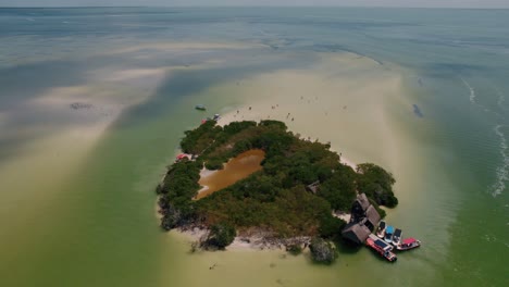 Coming-Into-Unique-Isolated-Ile-Full-Of-Trees-Middle-Of-Sea-Beach,-Riviera-Maya,-Mexico