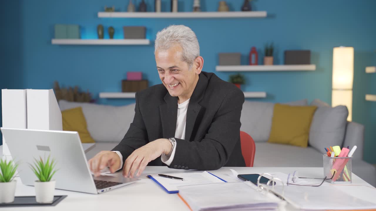 Home office worker man fun working on laptop, using it.