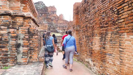 group walking through historic brick ruins