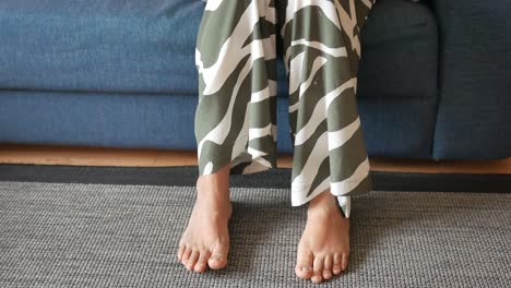 bare feet on a rug