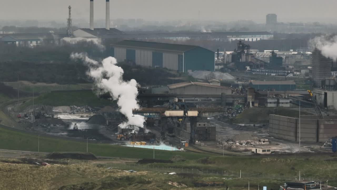 Aerial view of Tata Steel industrial area with smoke and smoggy atmosphere