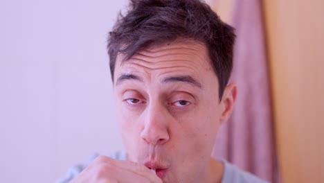 man wakes up and falls asleep while brushing his teeth