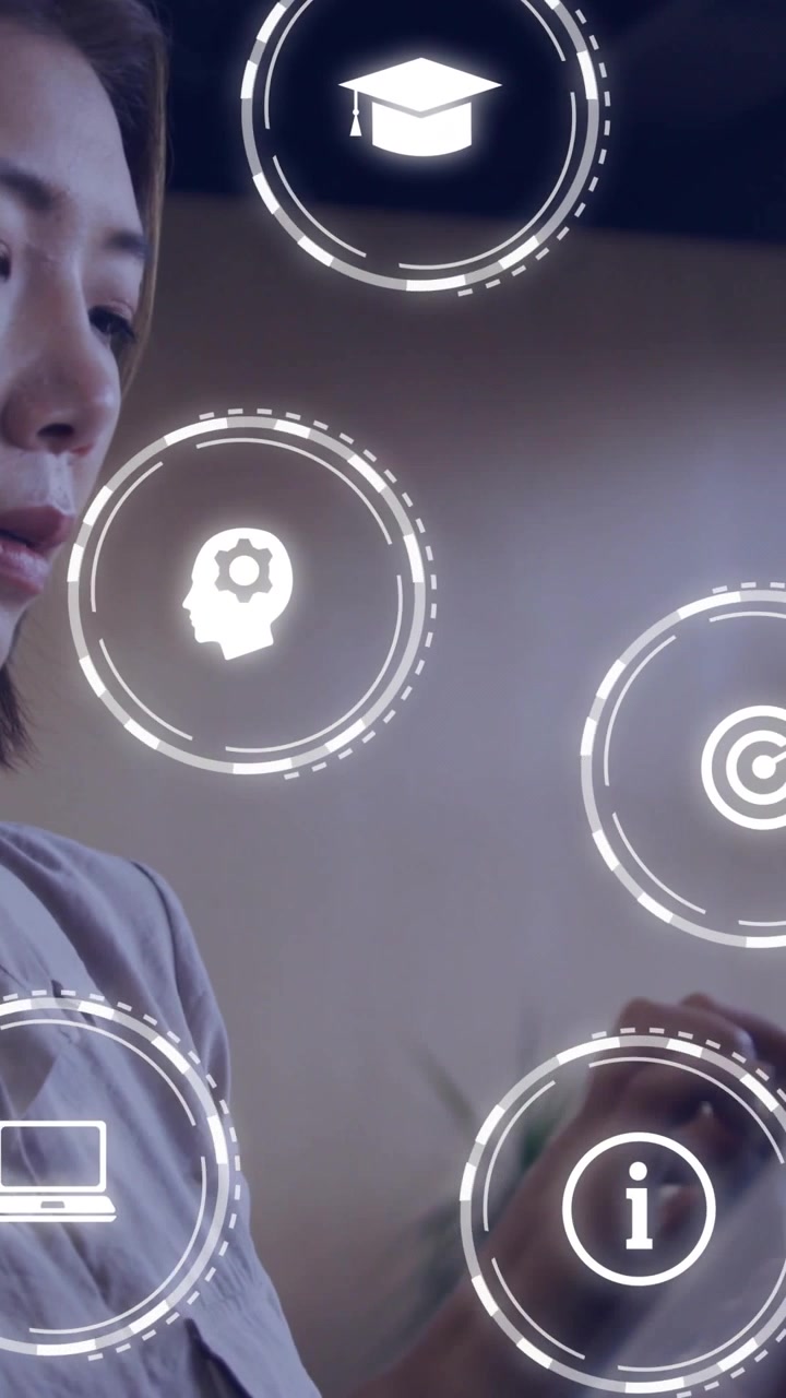 Vertical video: Asian woman gazing at device as HUD icons rising hand tapping icons choosing goals