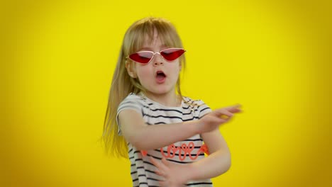 Little-teen-kid-child-girl-in-sunglasses-listening-music-dancing-disco,-fooling-around,-having-fun