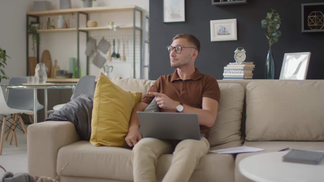 Father working from home with child in background