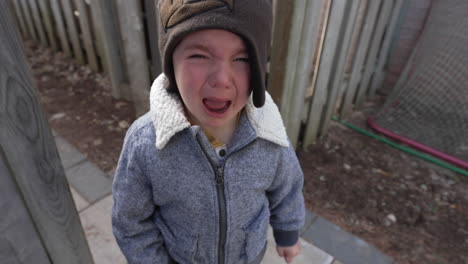 angry toddler boy having a temper tantrum