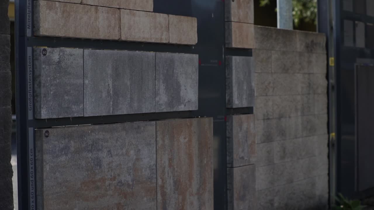 Colorful stone pavers from the proActive Mittelpflastersystem, available in various sizes and styles. Showcased in a warehouse for material estimation and offers.