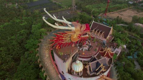 Close-cinematic-droneshot-of-the-dragon-statue-at-the-wat-semphran-temple-in-Bangkok,-thailand