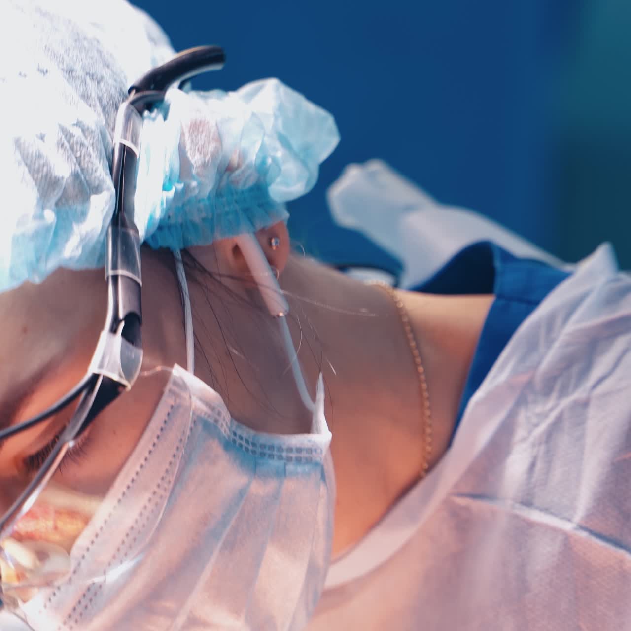 Professional doctors in medical uniform making an operation. Process of operation by neurosurgeons. Close-up.