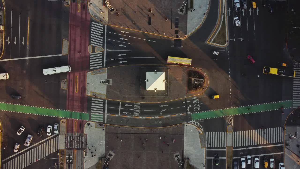 Aerial Top-Down View of Busy City Intersection with Moving Traffic