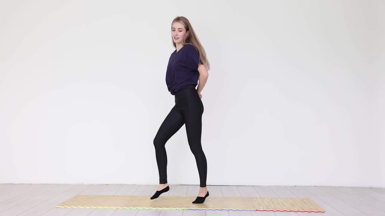 Woman Exercising on Yoga Mat