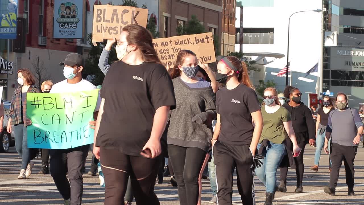 Placard signs of support held overhead in march for Black Lives Matter