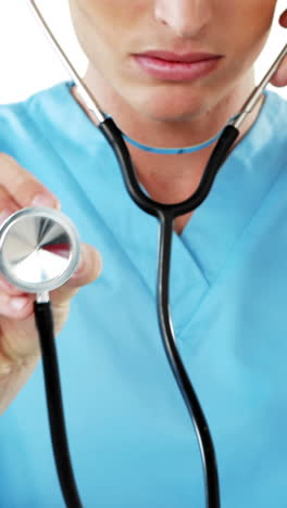 close-up of male surgeon checking with stethoscope