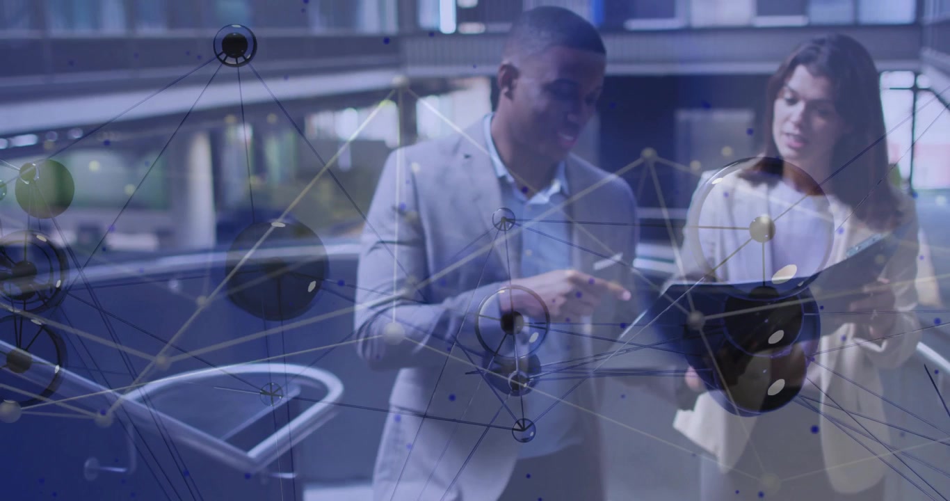Pulsing tech overlay revealing atrium colleagues walking explaining tablet business data