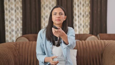 TV-remote-not-working,-Indian-woman-trying-to-fix-it