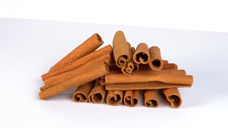 Cinnamon-stick-stacked-on-white-background-dynamic-slider-shot